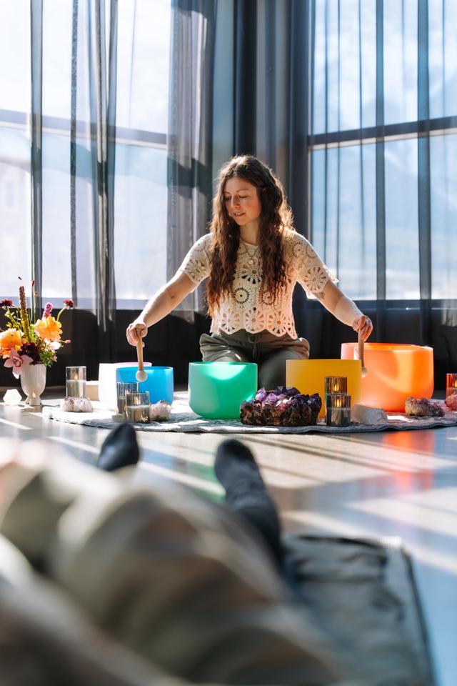 Crystal singing bowls arranged for a sound bath session